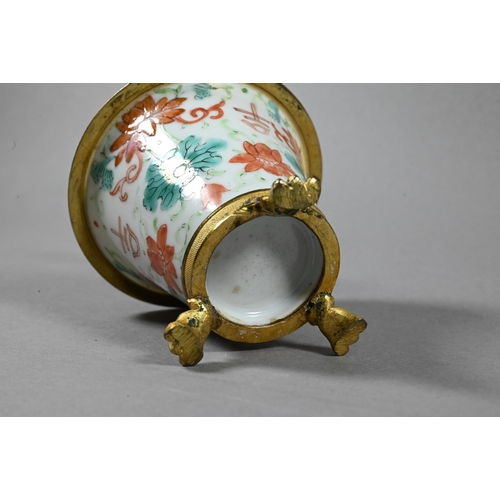 490 - A 19th century Chinese tea bowl of tapering form painted with flowering lotus in red and green ename... 