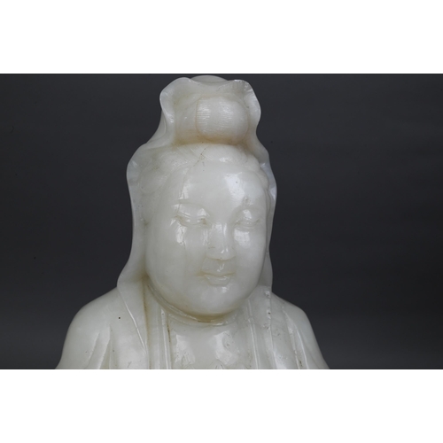 495 - A large Chinese carved alabaster figure (the bodhisattva of compassion) Guanyin seated upon a carved... 