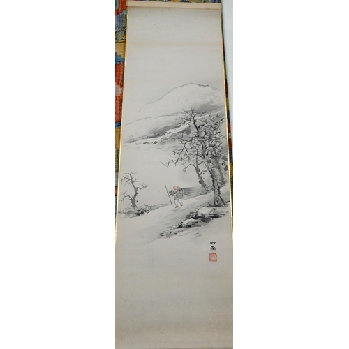 505 - A Singaporean traditional hand scroll painting, ink and colour on silk with a figure walking through... 