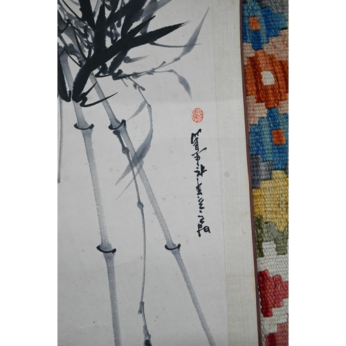 505 - A Singaporean traditional hand scroll painting, ink and colour on silk with a figure walking through... 