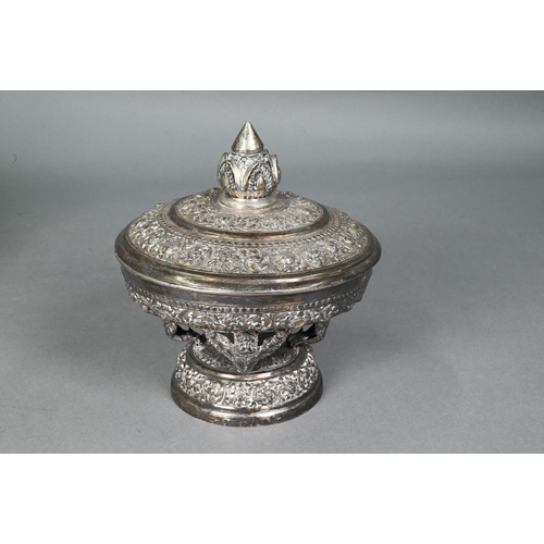 508 - A South East Asian silver stem bowl and cover with lotus bud finial, profusely embossed and engraved... 