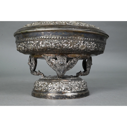 508 - A South East Asian silver stem bowl and cover with lotus bud finial, profusely embossed and engraved... 