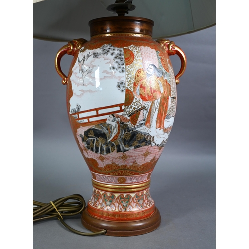 515 - A late 19th century Japanese Kutani vase (now lamp mounted) with mythical beast mask handles, painte... 