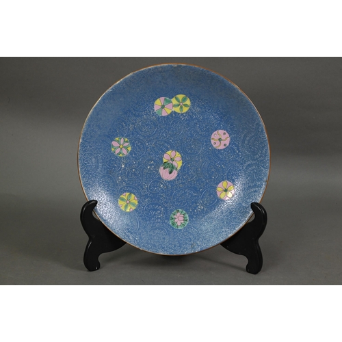 518 - A 19th century Chinese blue ground scraffito plate painted in polychrome enamels with polychrome flo... 