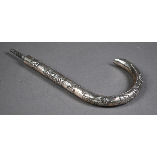 519 - A vintage parasol with early 20th century Chinese export silver handle decorated with a sinuous high... 