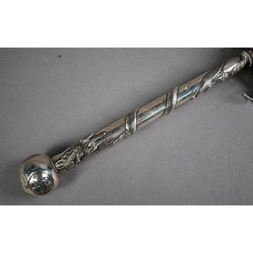 519 - A vintage parasol with early 20th century Chinese export silver handle decorated with a sinuous high... 