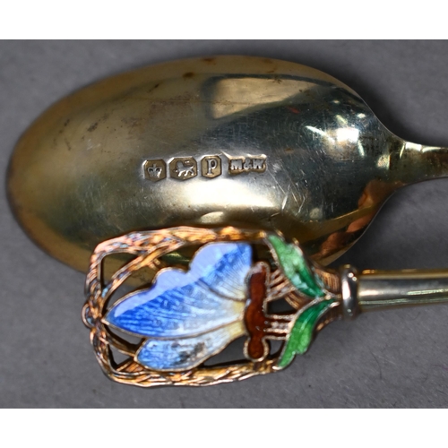 68 - Cased set of twelve Art Deco silver gilt coffee spoons with finials pierced and enamelled with butte... 