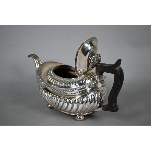 77 - George IV silver teapot in the Regency style, of half-reeded oblong form with foliate finial, gadroo... 