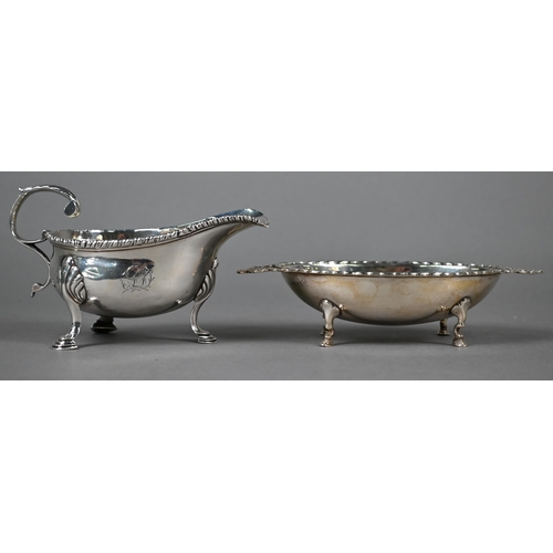 79 - Early George III small silver sauce boat with gadrooned rim and scroll handle, on three hoof feet, m... 