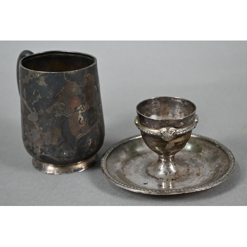 94 - Silver egg cup with integral saucer, Atkin Bros, Birmingham 1927, to/w a Christening mug, Sheffield ... 