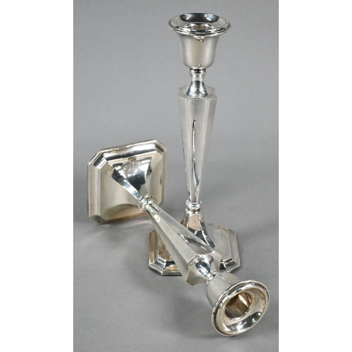 96 - Pair of loaded silver baluster candlesticks in the Art Deco style, on moulded square bases with cant... 