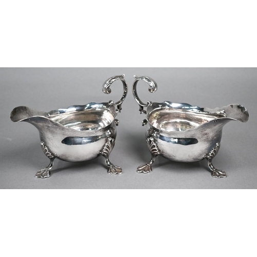 98 - Pair of George III silver pot-bellied sauce-boats with scroll handles and shell feet, Fuller White, ... 