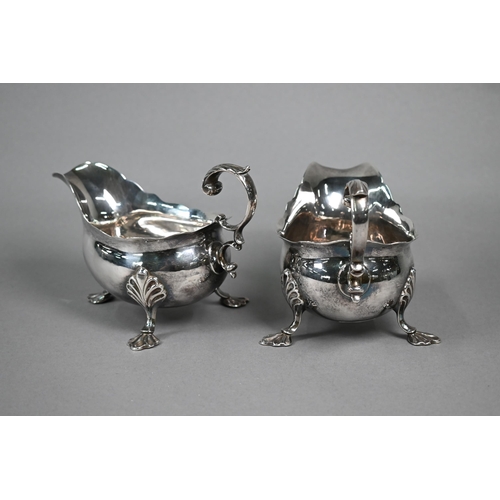 98 - Pair of George III silver pot-bellied sauce-boats with scroll handles and shell feet, Fuller White, ... 