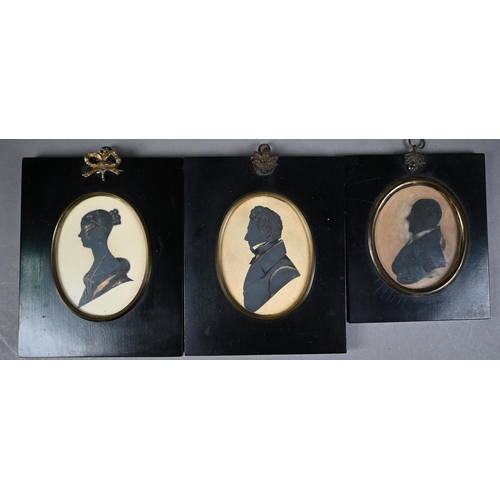 1115 - A pair of Victorian painted silhouette portraits, highlighted with gilt, and a husband and wife, Tho... 