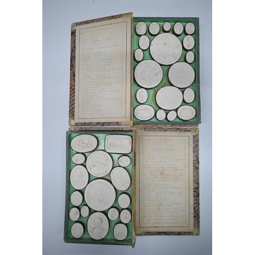 1116 - Two early 19th century Grand Tour sets of cast plaster classical relief plaques, in book-form cases ... 