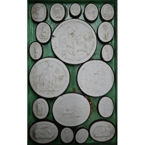 1116 - Two early 19th century Grand Tour sets of cast plaster classical relief plaques, in book-form cases ... 