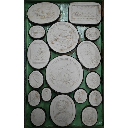 1116 - Two early 19th century Grand Tour sets of cast plaster classical relief plaques, in book-form cases ... 