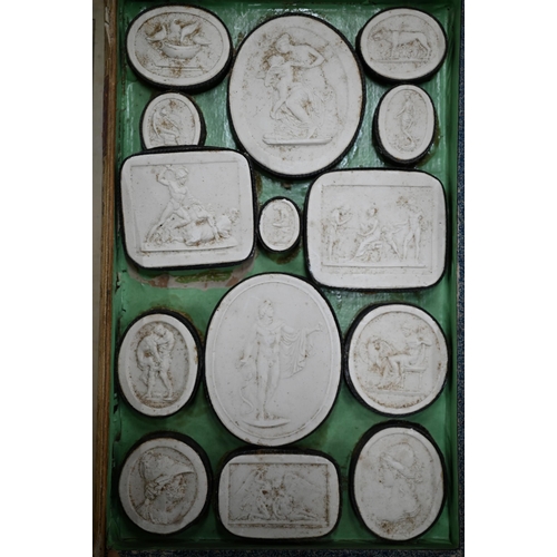 1116 - Two early 19th century Grand Tour sets of cast plaster classical relief plaques, in book-form cases ... 