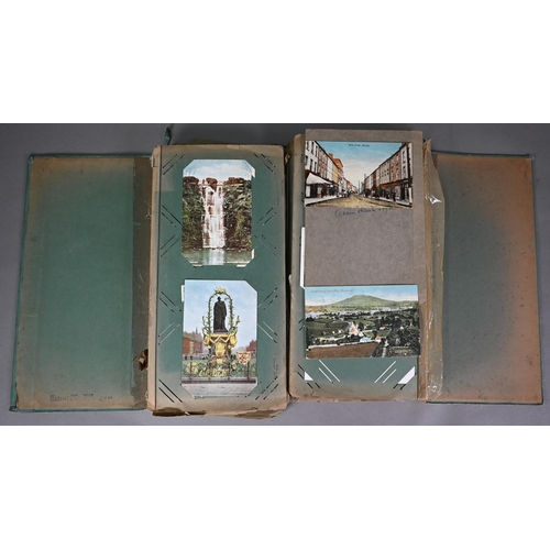 1118 - An unusual Edwardian double postcard album 'The Kabinet' (disbound), containing a quantity of postca... 