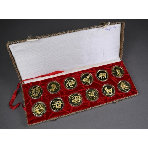 1147 - A boxed set of twelve Chinese Zodiac gilt coins in proof-cases, each 32mm diam