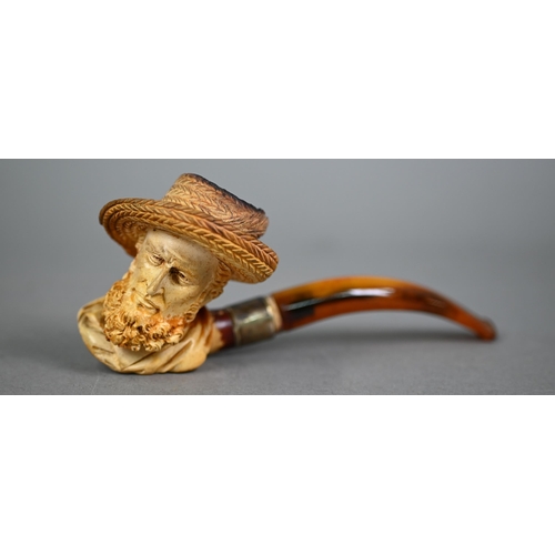 1169 - Edwardian Meerschaum pipe, carved as a bearded gentleman in a straw hat, on silver-mounted amber ste... 