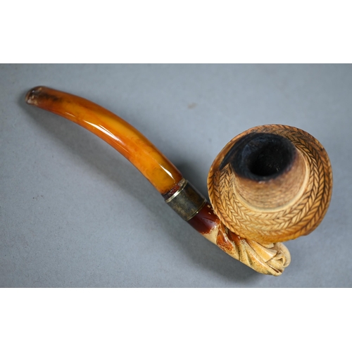 1169 - Edwardian Meerschaum pipe, carved as a bearded gentleman in a straw hat, on silver-mounted amber ste... 