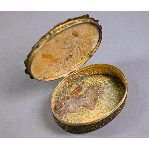 1172 - Continental oval gilt metal trinket box, the shagreen-mounted hinged cover inset with painted on ivo... 