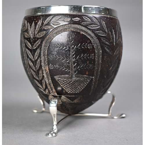 1184 - An 18th century coconut cup with later ep rim and feet, carved with Crown, Roses, Thistles and Harp,... 