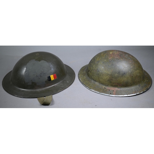 1198 - Two vintage tin helmets with liners to/w a tin containing assorted anchor branded tunic buttons and ... 