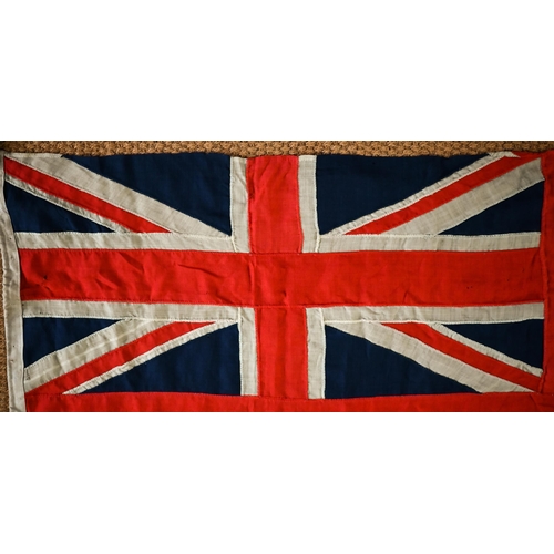 1199 - A WWII period Royal Navy ensign, of stitched panels with 'union jack' to top corner, stencilled 'C W... 