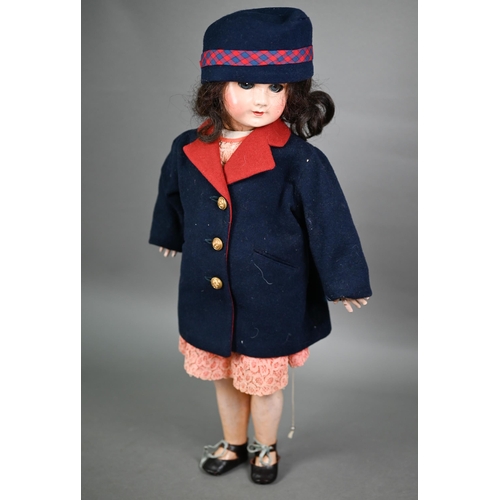 1204 - A 1920s composite girl-doll, dressed in tailored Naval jacket. 59 cm 