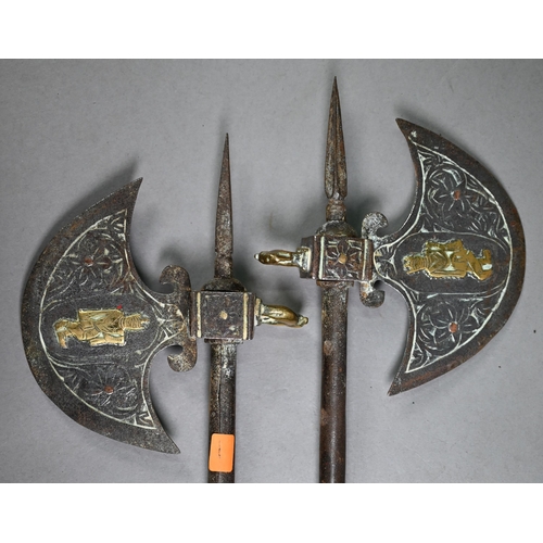 1209 - Pair of antique Indian steel axes with brass-mounted crescent blades and daggers concealed in the ha... 