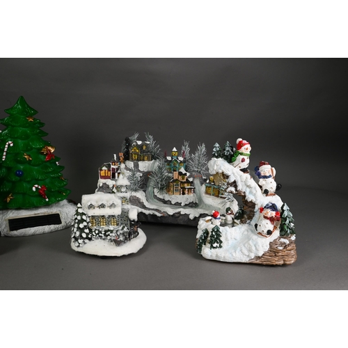 1250 - Six various modern decorative Christmas arrangements, including tree, snowman, villages etc