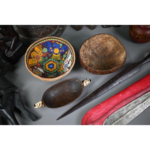 1273 - Quantity of tribal artefacts of mixed ethnography, including headhunters sword, bead work, carved wo... 