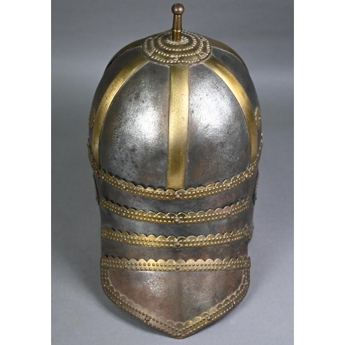 1296 - A 19th century Polish Hussars helmet, of rivetted and screwed form, on wood mount for display