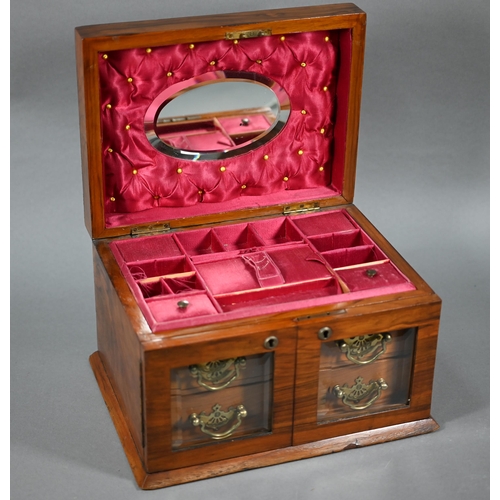 1309 - A late Victorian walnut jewellery box, the domed hinge lid enclosing a fitted interior, over a pair ... 