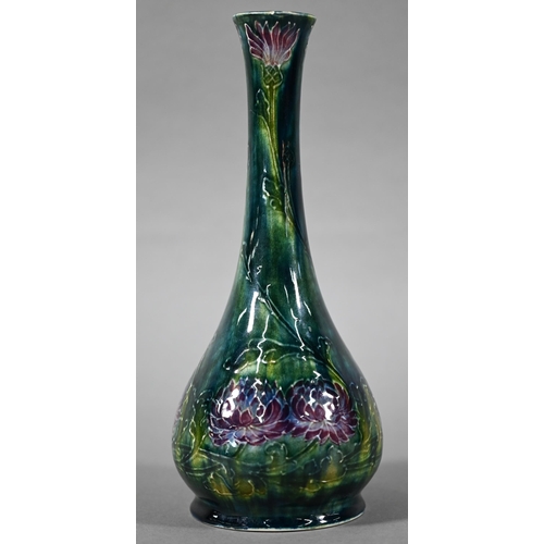 537 - Art Nouveau George Cartlidge Morris Ware slender vase with bulbous base, decorated with flowers, sig... 