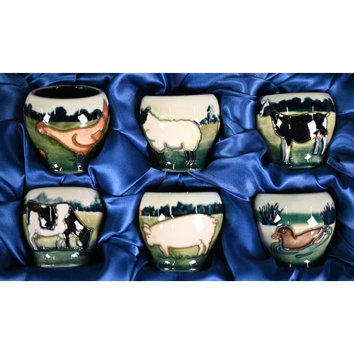 540 - Boxed set of six Moorcroft 'Farmyard' egg cups, designed by Angela Davenport (1998)