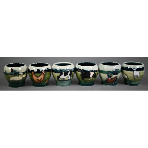 540 - Boxed set of six Moorcroft 'Farmyard' egg cups, designed by Angela Davenport (1998)