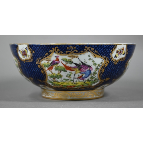 585 - A 19th century Continental porcelain punch-bowl in the manner of the 18th century Worcester factory,... 