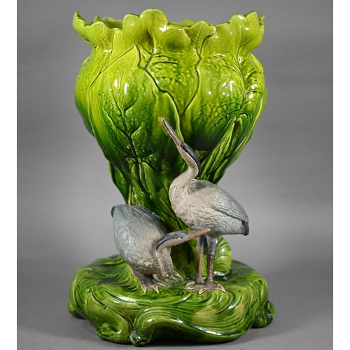 592 - Bretby majolica jardinière with moulded leaf design, the base mounted with two cranes, 40 cm high, n... 