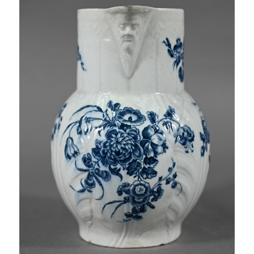 593 - First Period Worcester cabbage-leaf jug with Bacchus-mask spout and scroll handle, printed with blue... 