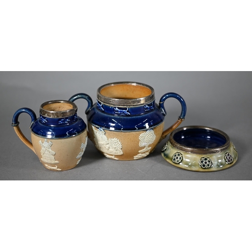 597 - Two Doulton stoneware silver-rimmed three-piece tea services and other similar wares