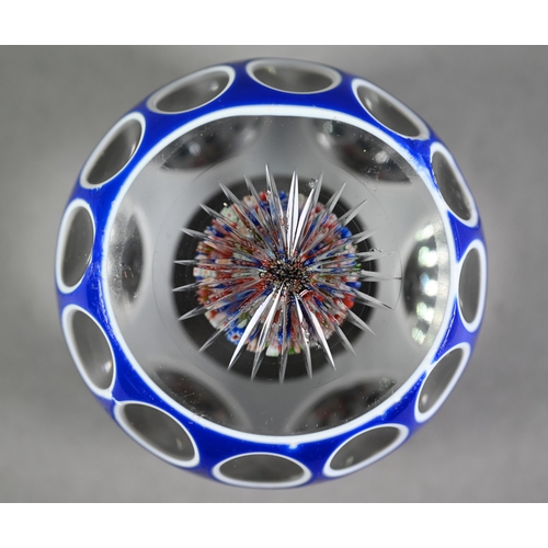 630 - Baccarat glass blue flash and facetted paperweight with small millefiori inner display and star-cut ... 