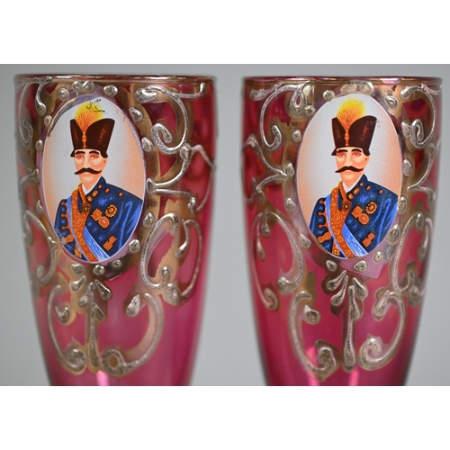 631 - Pair of Venetian cranberry flash champagne flutes, printed with portraits of moustachioed potentate,... 