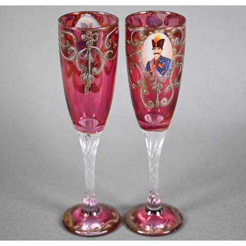 631 - Pair of Venetian cranberry flash champagne flutes, printed with portraits of moustachioed potentate,... 