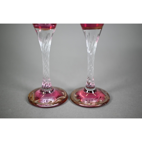 631 - Pair of Venetian cranberry flash champagne flutes, printed with portraits of moustachioed potentate,... 