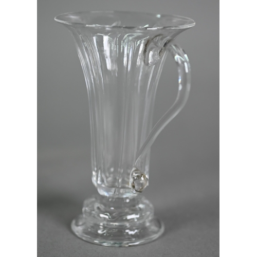 635 - A Georgian fluted jelly glass with flared rim and scroll handle, on ogee goot, 11.5 cm to/w a cordia... 