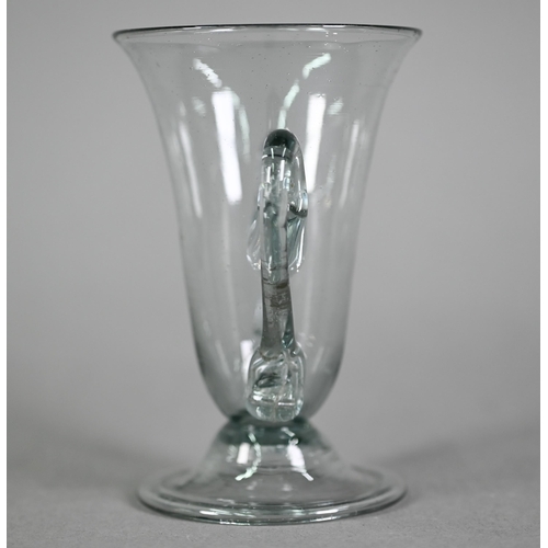 639 - A Georgian smoky jelly glass with twin scroll handles, on domed foot with folded rim, 10.5 cm