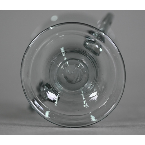 639 - A Georgian smoky jelly glass with twin scroll handles, on domed foot with folded rim, 10.5 cm